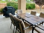 Back Yard Enclosed Patio with 6-Chair Table and Gas Grill